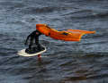 Wave riding in the goofy position (right foot in front)