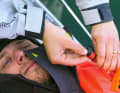 Let the air out: Back on deck, the inflated lifejacket gets in the way. That's why the first step is to deflate it