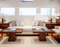 Deckhouse: Light-coloured paintwork and upholstery contrast with the mahogany fittings of the seating area, ...
