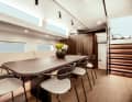 Saloon: The design concept devised by Norm Architects and Design Unlimited is tangible in the main living area on board: The interior is Scandinavian and elegant, yet inviting and cosy. On the starboard side, eight guests are seated at the dining table ...
