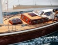 Style mix as a stylistic device. Recessed halyards, flush deck windows, portholes and skylights