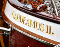 The name consists of hand-carved gold letters