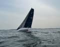 The "Powerplay" approaches the finish line off Strande with a fresh breeze