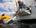 Back on the yacht. Now comes the most difficult part. The person has to get out of the water and is often barely able to help