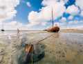 Dry-docked flat-bottomed ship off Terschelling. Current data for the Waddenzee can now be retrieved digitally
