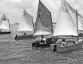 Historical photo of an early regatta in the Optimist Pram. The loose foot corresponded to the first building regulations