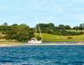 A yacht enters Dyvig. The bay in the north-west of Als is one of the most popular anchorages in the area
