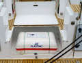 The life raft is located in a compartment at the stern. It would be easy to reach in an emergency