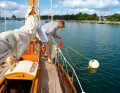 Mooring from the deck can be tedious. A patent mooring hook makes it easier to thread in the mooring line
