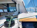 The sheets, halyards and trim lines are deflected aft. The helmsman can manage perfectly well on his own