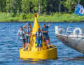 The crew of the "Lisa" on the famous yellow post bin off Törehamn