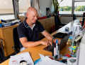 The club manager and sports director at his workplace in the clubhouse of the NRV, which was founded in 1868. The address is Schöne Aussicht 37: Schöne Aussicht 37 - the name says it all: Klaus Lahme looks out over the jetties directly onto the picturesque and challenging waters of Hamburg's Outer Alster lake