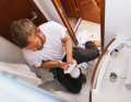 Mario Graichen repairs the on-board toilet