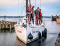 Together we are stronger. The "Five Oceans" with its special crew in the harbour entrance of Lyø By