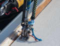 Securing the halyards: In strong winds, the halyards are best kept well away from the mast. Here on the foredeck, attached to the eye for the stretch ropes, they cannot swing against the mast