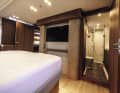 The skilfully slotted solid wood panels can also be found aft.