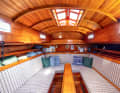 Unusual: the saloon ends in front of the mast with a bulkhead. The bow berths are accessible via an entrance in the foredeck.