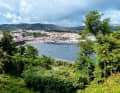 From the green hills, the view falls down to the anchored yachts off Angra do Heroísmo. The oldest city in the Azores is a World Heritage Site.