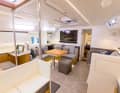 The new saloon: some fixtures have been removed, others have been remodelled and many surfaces have been wrapped in foil. The fabric upholstery is now grey and there is plenty of LED lighting.