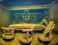 Chairs, a table, and above it the frame of a pendant light: a glimpse inside the wreck of the 1913.