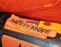 To cut the liferaft loose, it is equipped with a cross-cut knife.