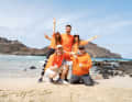 The "Internet King" and his followers: Knossi (below left) with one of the two crews he sent across the Atlantic.
