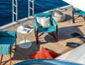 Comfort in the beach club: "Salina" chair by Paola Lenti with double fabric upholstery and internal padding.