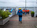 Wearing rainproof clothing and equipped with a lifejacket, we board the boat.