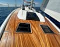 An overlapping genoa is one option. The standard choice is the self-tacking jib.