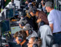 The coaches and owners of all the teams, here Sebastian Vettel, follow the action on the track from the coaching zone.