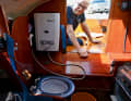 Below deck there is a fully equipped toilet as well as a hot water shower.