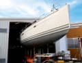 Customised work. A Hanse 56 is manoeuvred into the hall centimetre by centimetre.
