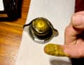 Contaminated coolant is a sign of a faulty cylinder head gasket.