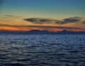 From the anchorage at Loch Ceann Traigh, there is an unobstructed view of the Hebrides at sunset.
