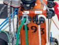 A number of controls converge in the centre of the towering mainsheet platform. A traveller rail is mounted on the stern.