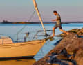 A change of world. Stepping on board is seen as a metaphor for stepping away from everyday life.