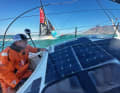 Racing Imocas at the start of the third Ocean Race leg with Charlie Enright in the foreground