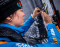 Justine Mettraux sews another reinforcement on the luff