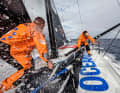 Charlie Enright and Damian Foxall working on deck for the US team 11th Hour Racing