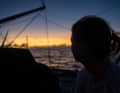 Here, "Guyot" sailor Anne-Claire le Berre looks at the horizon, where a few dark clouds are currently gathering for her team