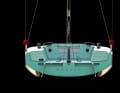 Rooster pot instead of traveller for the mainsheet. Retractable twin rudders hang from the 2.70 metre wide stern, and the standard swivel keel is designed to allow easy trailering.