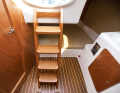 Companionway: Four steps down, like on a large boat. The cockpit is high, with plenty of space underneath
