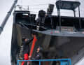 The crew making final preparations before the Imoca is launched again