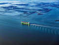 Container ship in the Wadden Sea (symbolic image)