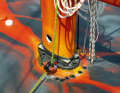 The mast is on deck; the tension is applied hydraulically. The halyards are routed below deck.