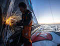 Until the sparks fly: Jack Bouttell cuts off the protruding bolt ends on the repaired mainsail