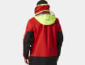The hood with visor against spray and storms. It can be stowed in the collar