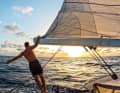 Freedom on the ocean: Tim Hund on the boom of the "Arrya" sailing into the sunset