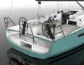 Folding seats for the helmsman are available as an option. The life raft is stored aft in a separate compartment