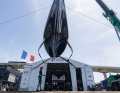 Here the futuristic foiler is still hanging in the crane
